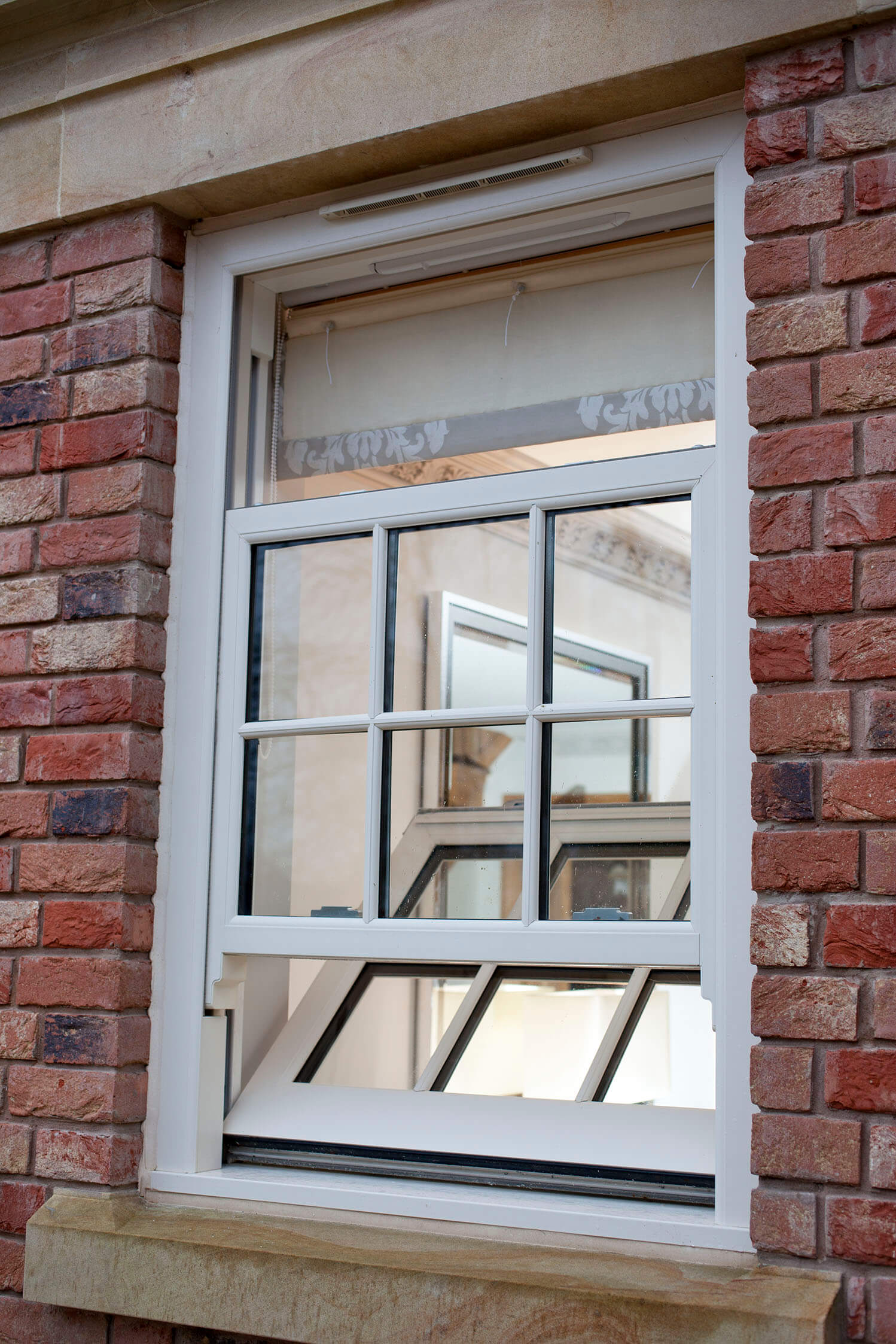 white vertical sliding window