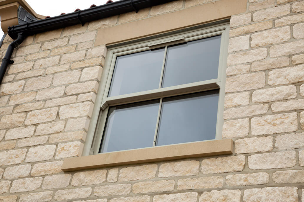 Sage green sliding sash window